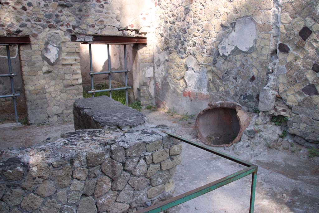 IV.17 Herculaneum. September 2019. Looking west across bar-room towards north-west corner and north wall.
Photo courtesy of Klaus Heese.